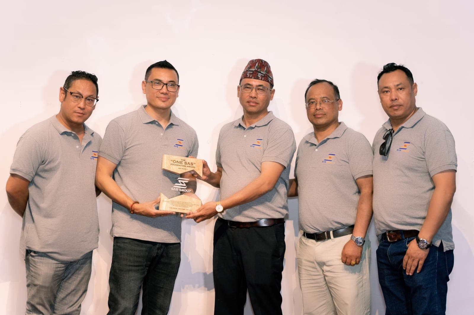 SAS Group colleagues receiving the "One SAS" Foundation Award